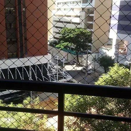 Em *